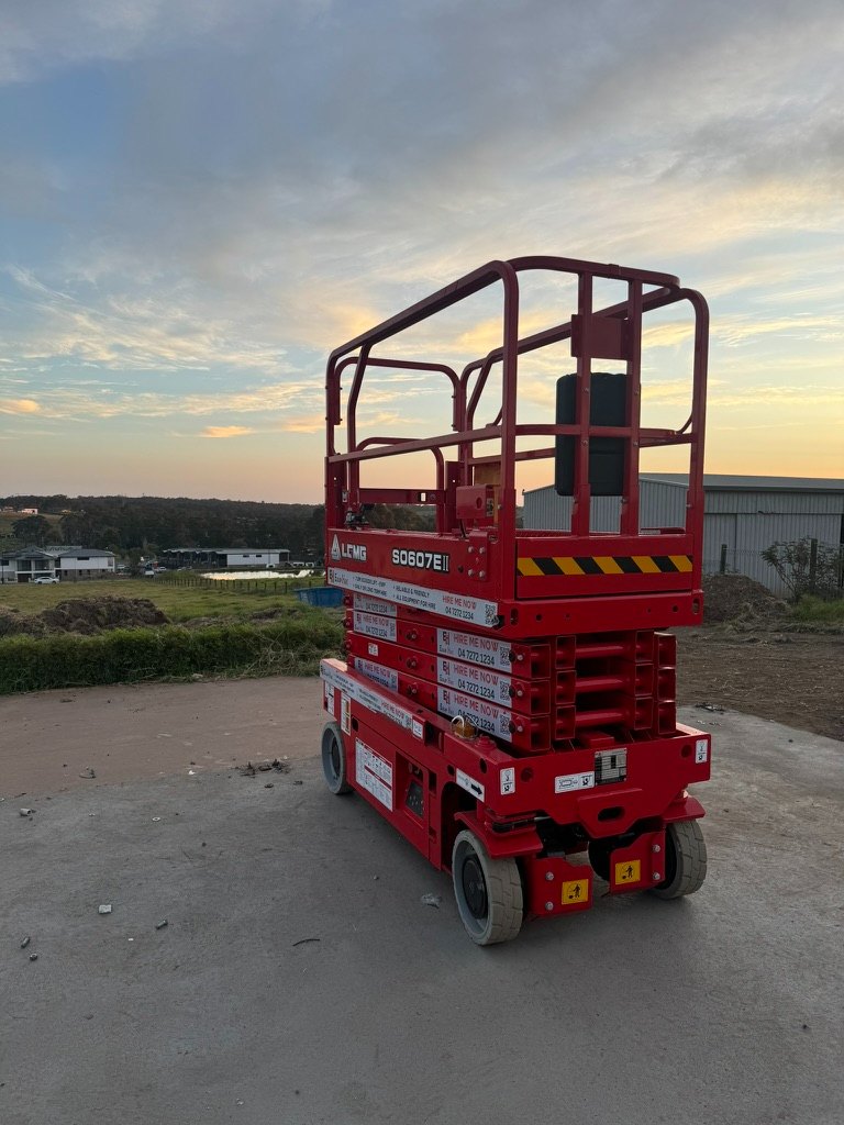 LGMG S0607E II electric scissor lift from the Equip Hire fleet, at Berkshire Park in Western Sydney at sunset