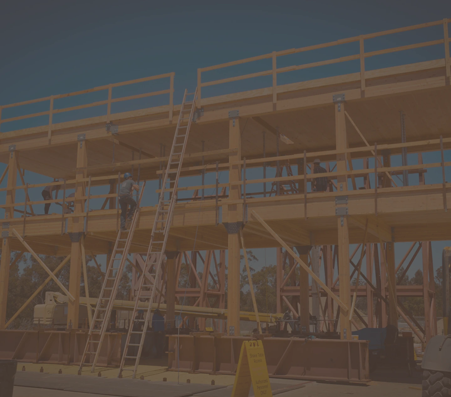 Construction workers using access equipment on a building site in Sydney