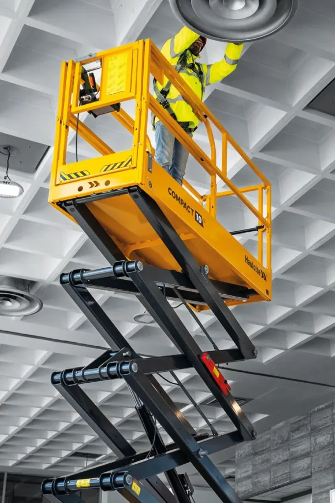Haulotte Compact 8N narrow electric scissor lift raised to working height — view 3, available for hire from Equip Hire in Sydney.
