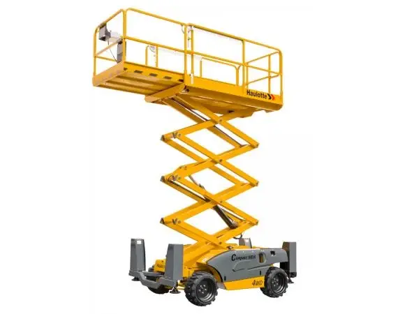 Haulotte Compact 12 DX 32ft diesel rough terrain self-levelling scissor lift raised to working height, available for hire from Equip Hire in Sydney.