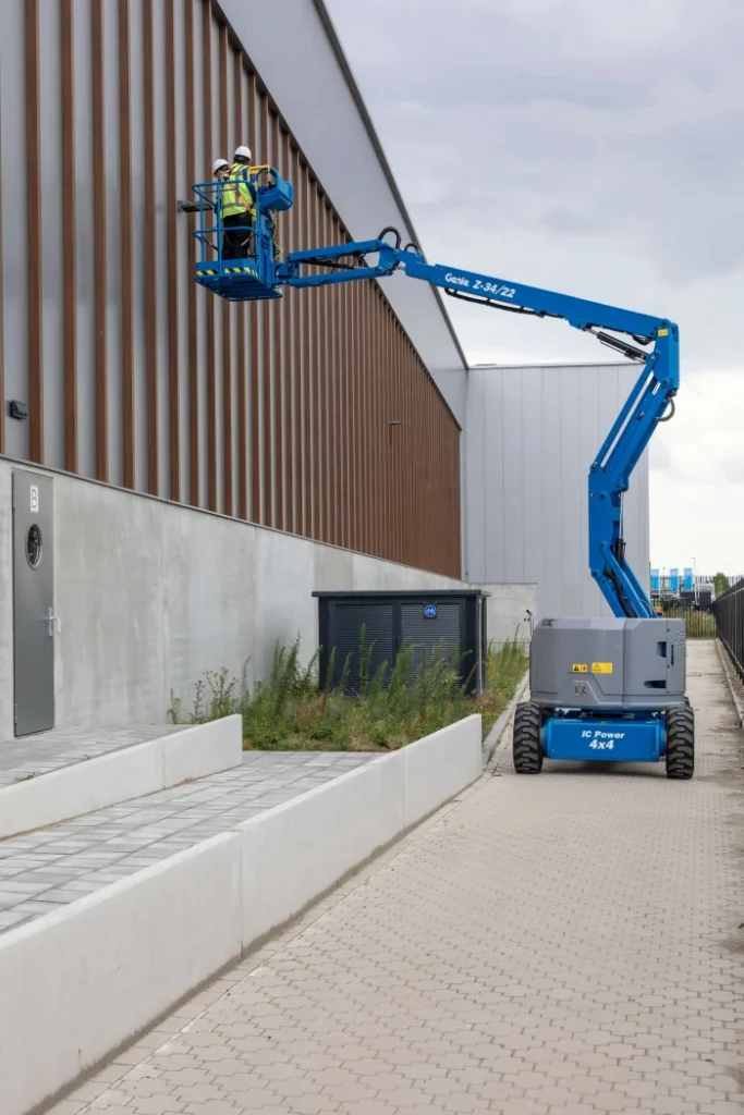Genie Z-34/22 knuckle boom lift, boom raised — view 4, available for hire from Equip Hire in Sydney.
