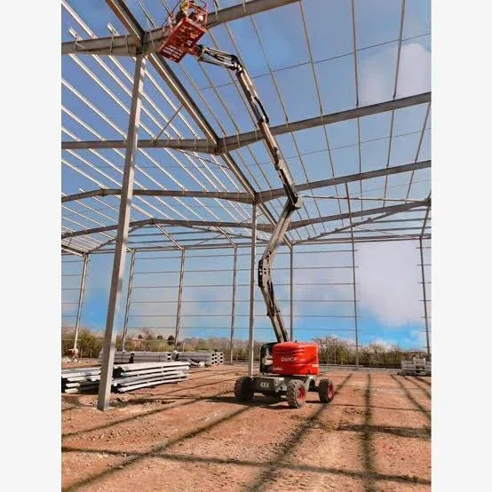 Skyjack SJ51 AJ knuckle boom lift working on an outdoor site, available for hire from Equip Hire in Sydney.